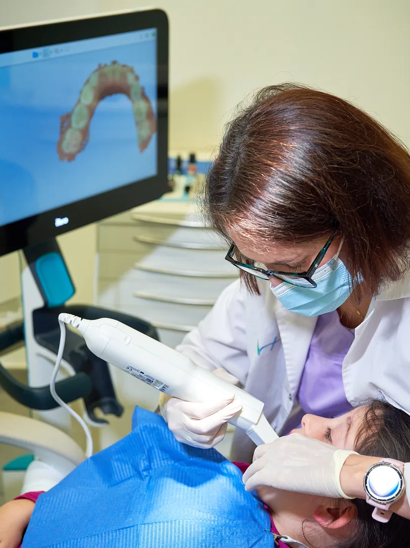 Orthodontist reviewing a clinical case remotely with digital planning tools